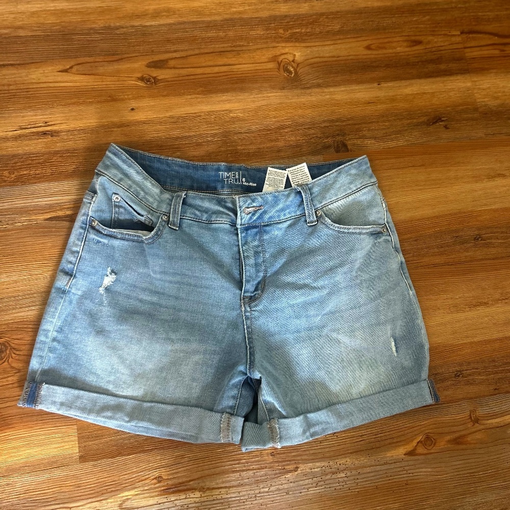 Cuffed distressed jean shorts. Size 6. Mid rise. Some stretch.